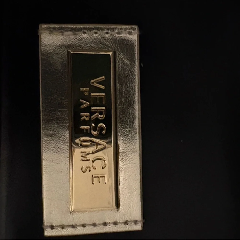 Versace Perfums Black Leather Wristlet with Gold Accents